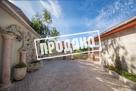 Дом с отделкой из камня у подножья горы Ахун