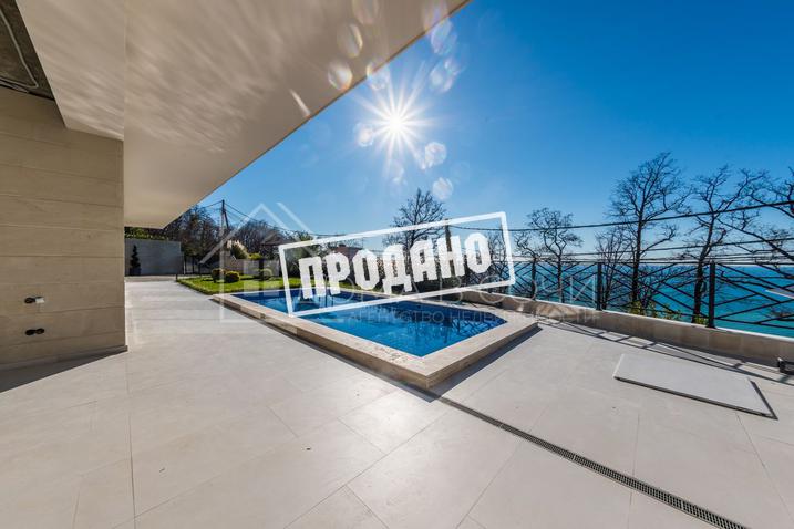 Коттедж с видом на море в стиле Райта №8