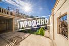Дом с отделкой из камня у подножья горы Ахун